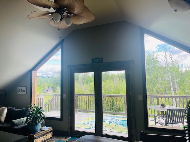 entryway featuring a wealth of natural light, lofted ceiling, and ceiling fan