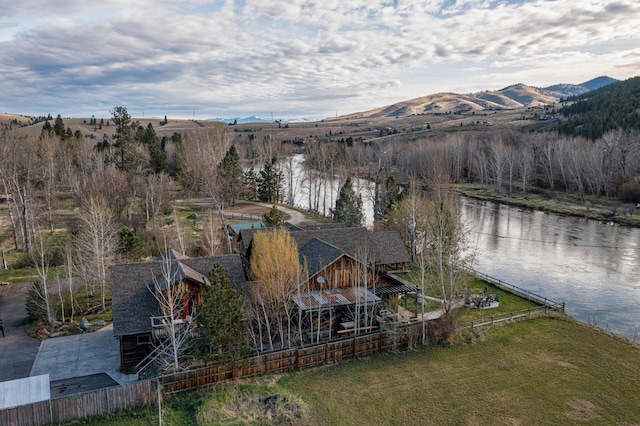 exterior space featuring a water and mountain view