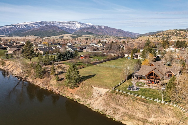 drone / aerial view with a water and mountain view