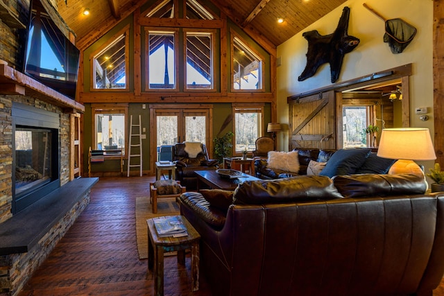 living room with beamed ceiling, wooden ceiling, dark hardwood / wood-style floors, a stone fireplace, and high vaulted ceiling