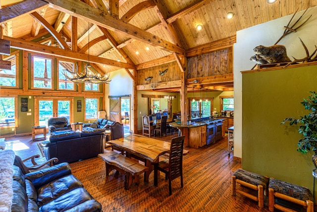 living room featuring high vaulted ceiling, wooden ceiling, beamed ceiling, and a chandelier