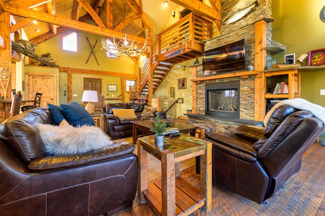 living room featuring a fireplace, a notable chandelier, hardwood / wood-style flooring, high vaulted ceiling, and beamed ceiling