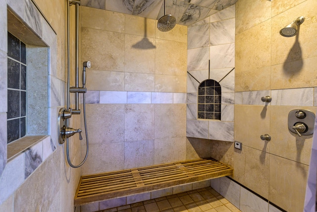 bathroom with a tile shower