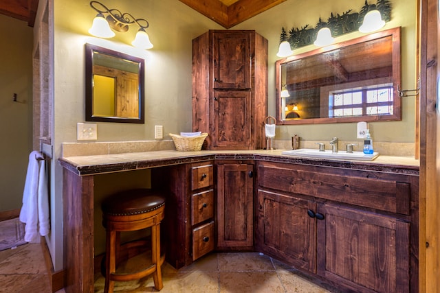 bathroom featuring vanity and tile floors