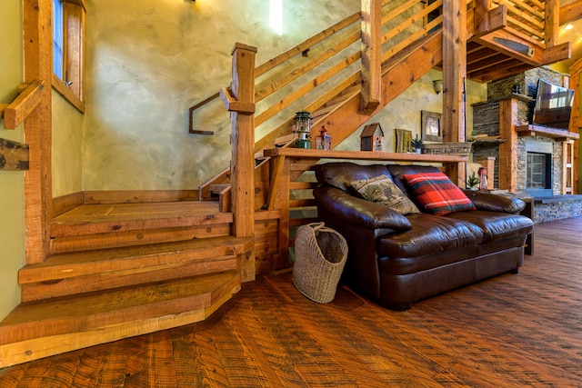 interior space with brick wall and hardwood / wood-style flooring