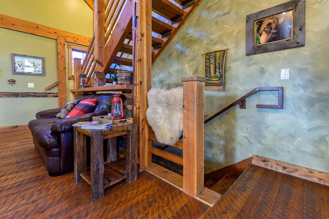 staircase with dark hardwood / wood-style flooring