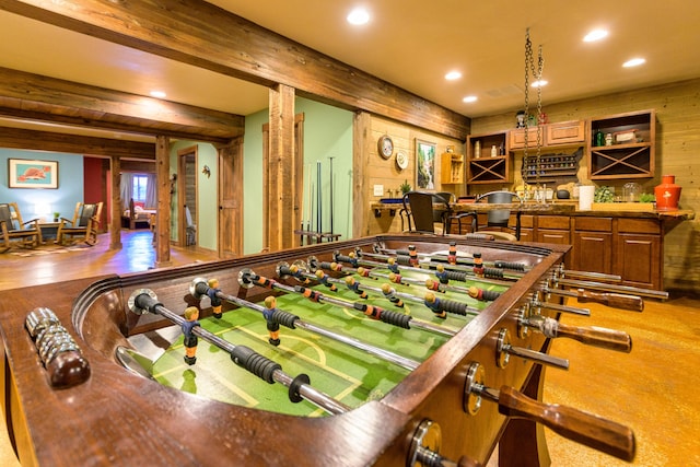 recreation room with wooden walls