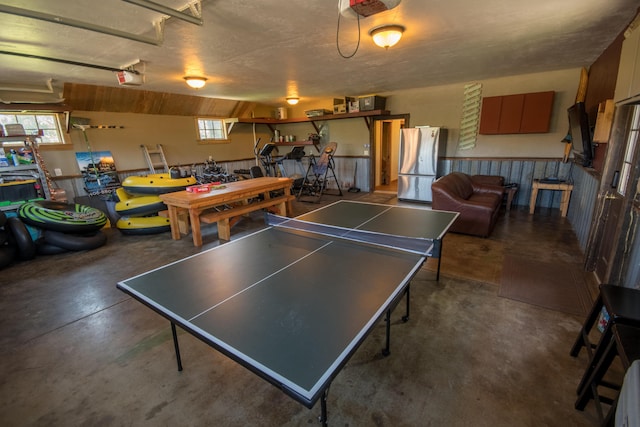 game room with plenty of natural light and concrete floors