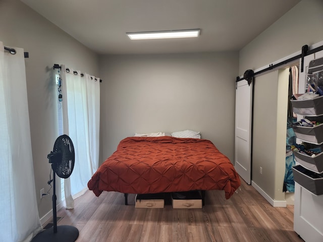 bedroom with hardwood / wood-style floors