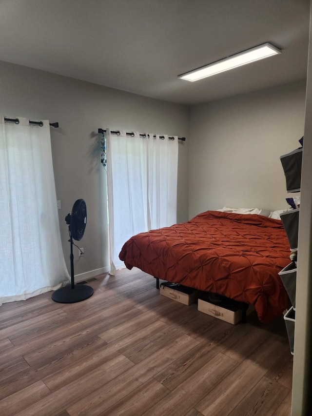 bedroom with wood-type flooring