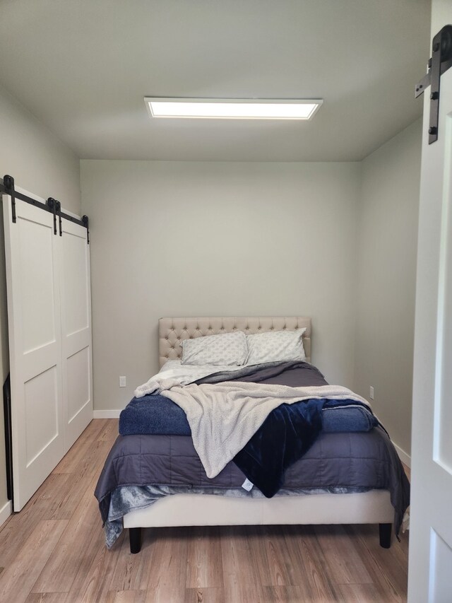 bedroom with light hardwood / wood-style flooring