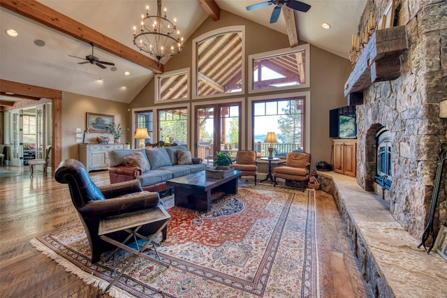 living room featuring beamed ceiling, ceiling fan, wood-type flooring, and high vaulted ceiling