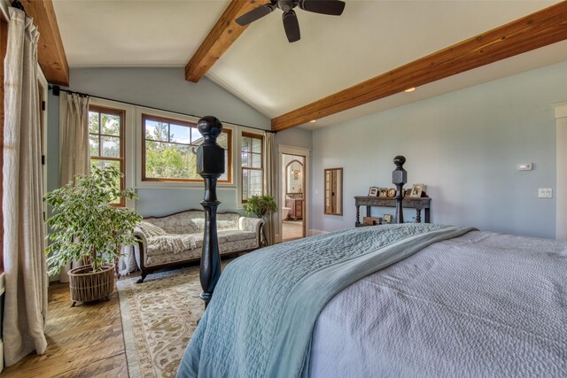 bedroom featuring lofted ceiling with beams, ceiling fan, and light hardwood / wood-style floors