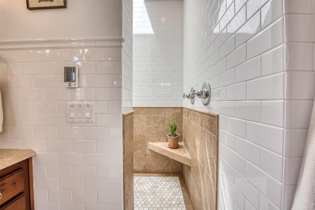 bathroom with vanity and a shower