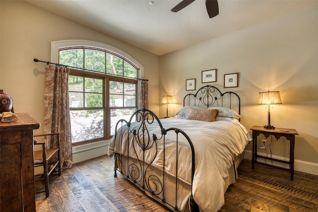 bedroom with dark hardwood / wood-style flooring and ceiling fan