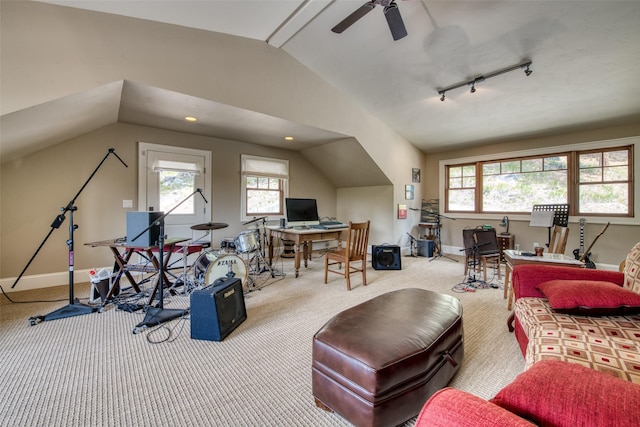 carpeted living room featuring vaulted ceiling, ceiling fan, and track lighting