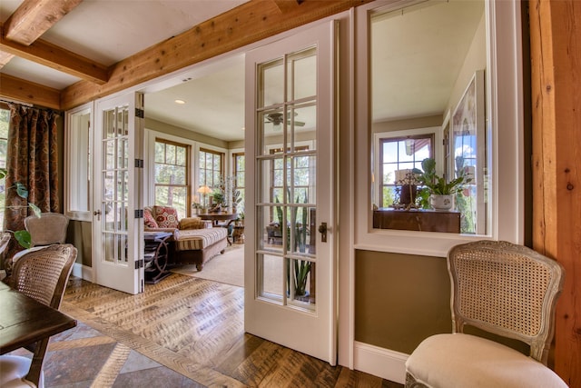 doorway to outside with beamed ceiling, parquet flooring, french doors, and a wealth of natural light