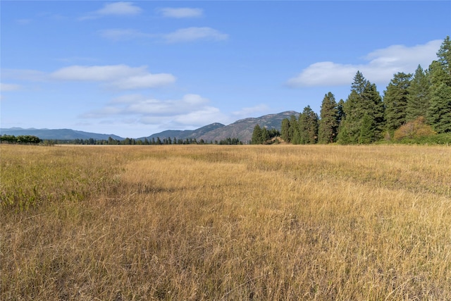 mountain view featuring a rural view