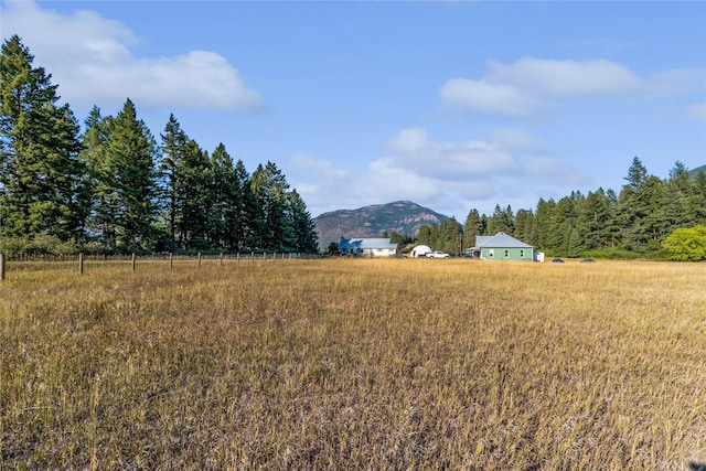 view of yard featuring a mountain view and a rural view