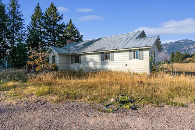 view of home's exterior featuring a mountain view