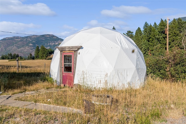 view of outbuilding with a mountain view