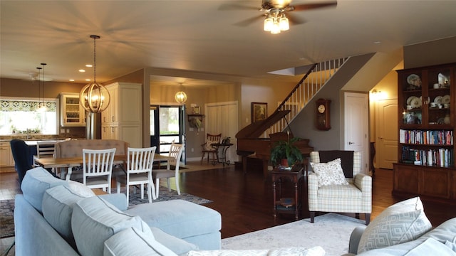 38648 Masumola Rd, Polson, MT 59860 - living room with recessed lighting, ceiling fan with notable chandelier, stairway, and wood finished floors