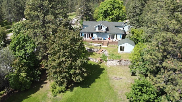 38648 Masumola Rd, Polson, MT 59860 - drone / aerial view featuring a wooded view