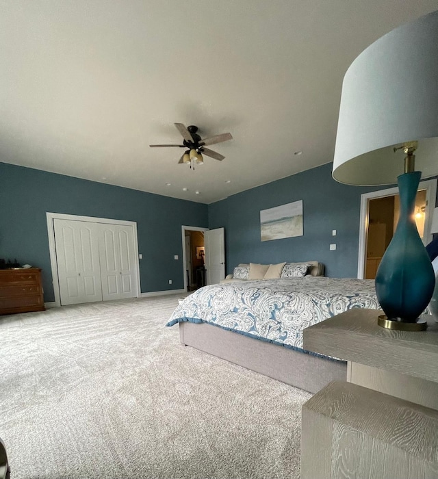38648 Masumola Rd, Polson, MT 59860 - bedroom featuring a closet, a ceiling fan, baseboards, and carpet