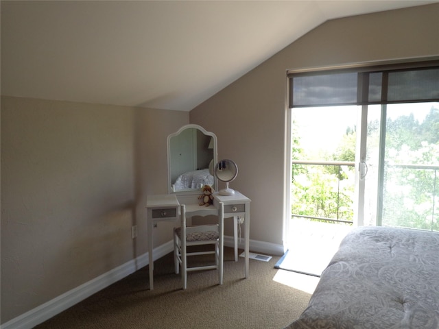 38648 Masumola Rd, Polson, MT 59860 - carpeted bedroom featuring access to outside, baseboards, visible vents, and vaulted ceiling