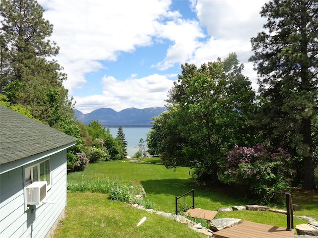 38648 Masumola Rd, Polson, MT 59860 - view of yard with a deck with water view and cooling unit