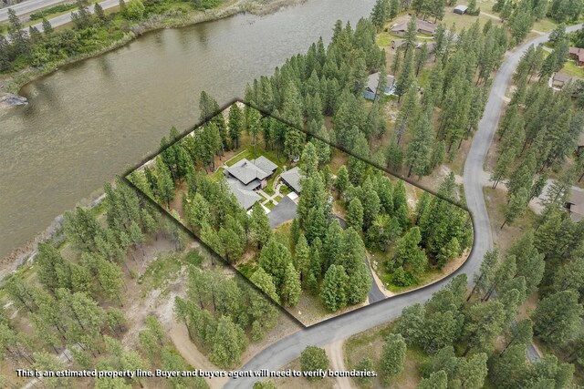 birds eye view of property with a water view