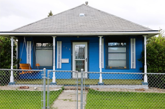 bungalow-style house with a front yard