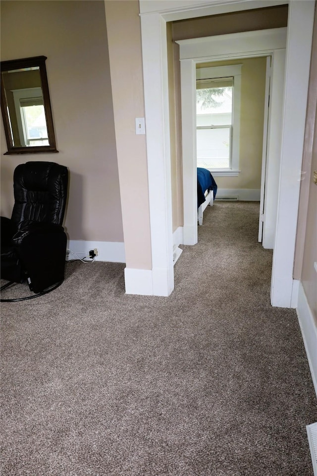 corridor featuring carpet flooring