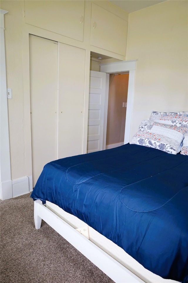 carpeted bedroom featuring a closet