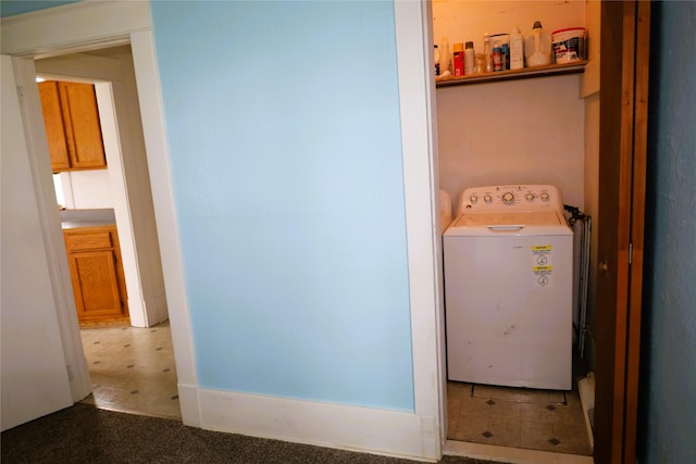 clothes washing area featuring carpet flooring and washer / clothes dryer