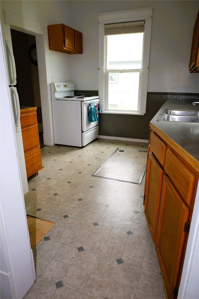 kitchen with sink and white appliances