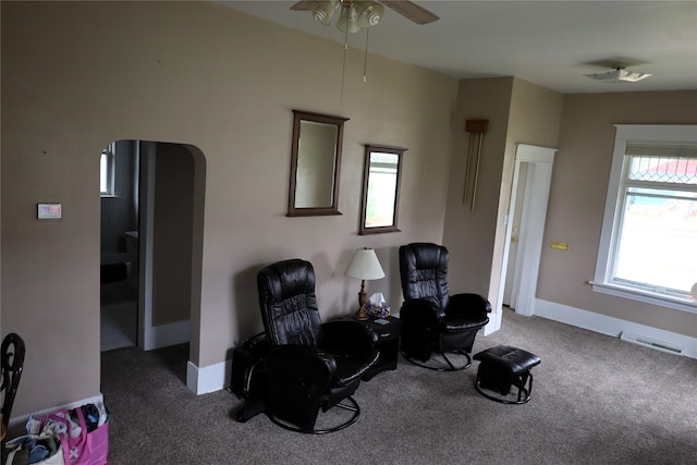 sitting room with carpet floors and ceiling fan