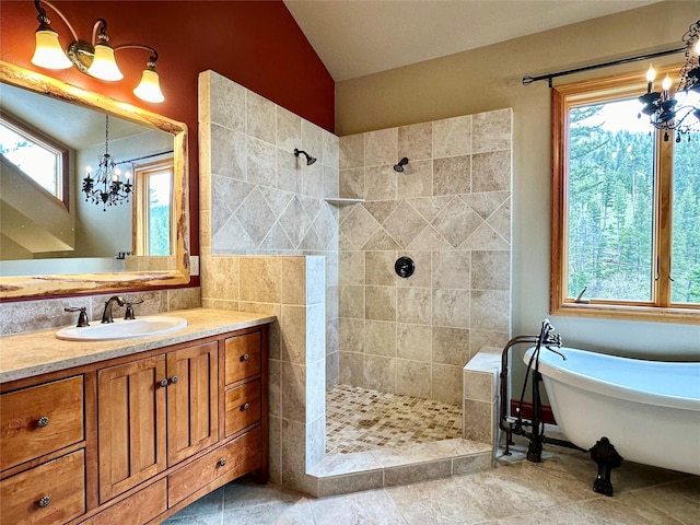 bathroom with lofted ceiling, vanity, plus walk in shower, and a notable chandelier