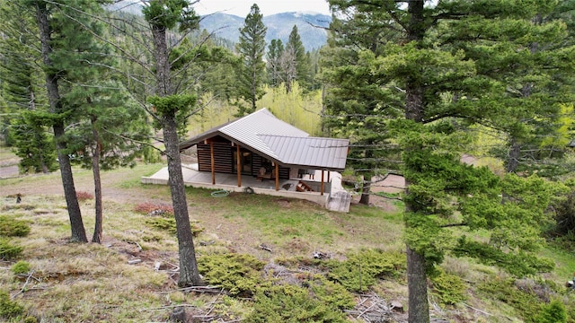 rear view of house with a mountain view