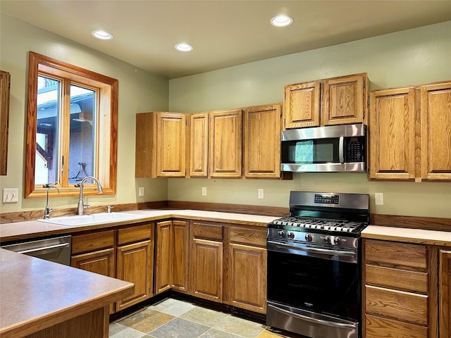 kitchen featuring appliances with stainless steel finishes and sink