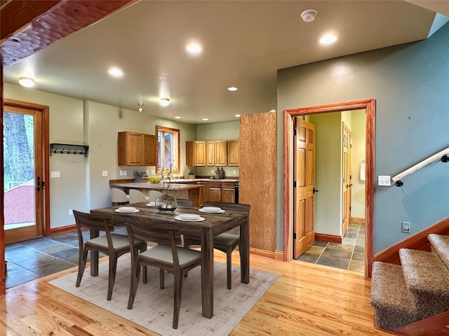 dining area with light hardwood / wood-style flooring