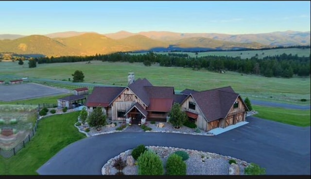 bird's eye view featuring a mountain view and a rural view