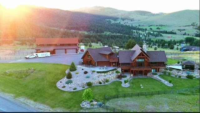 aerial view at dusk featuring a rural view