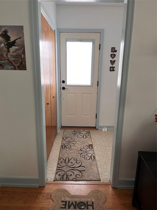 doorway with light hardwood / wood-style floors