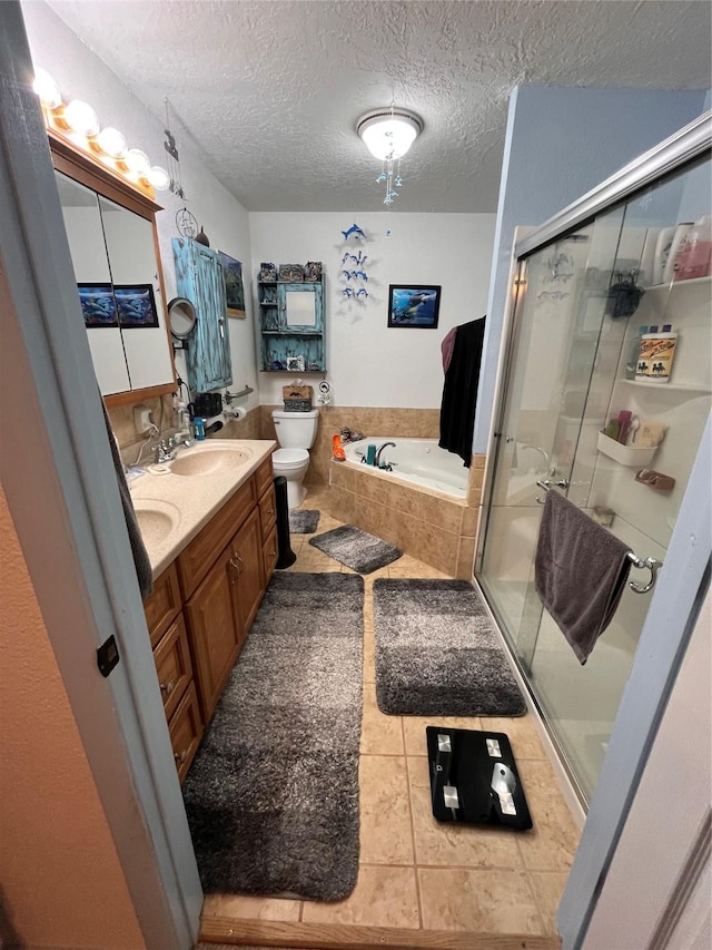 full bathroom featuring a textured ceiling, vanity, independent shower and bath, tile patterned flooring, and toilet