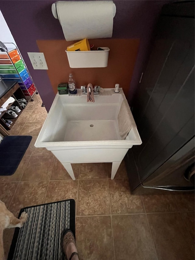 bathroom featuring tile patterned flooring and sink