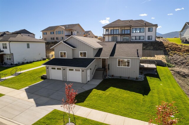 view of front facade with a garage and a front yard