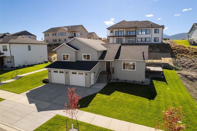 view of front of home featuring a garage and a front lawn