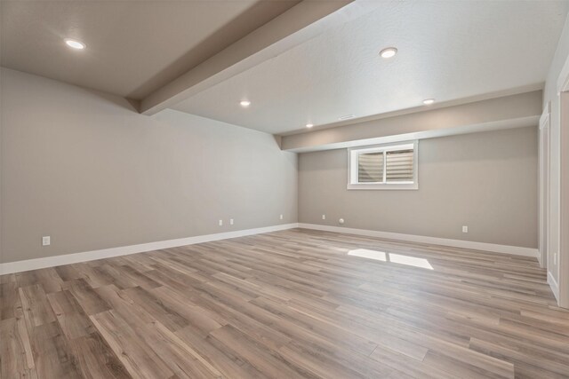 basement featuring light hardwood / wood-style floors