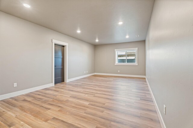 unfurnished room featuring light wood-type flooring